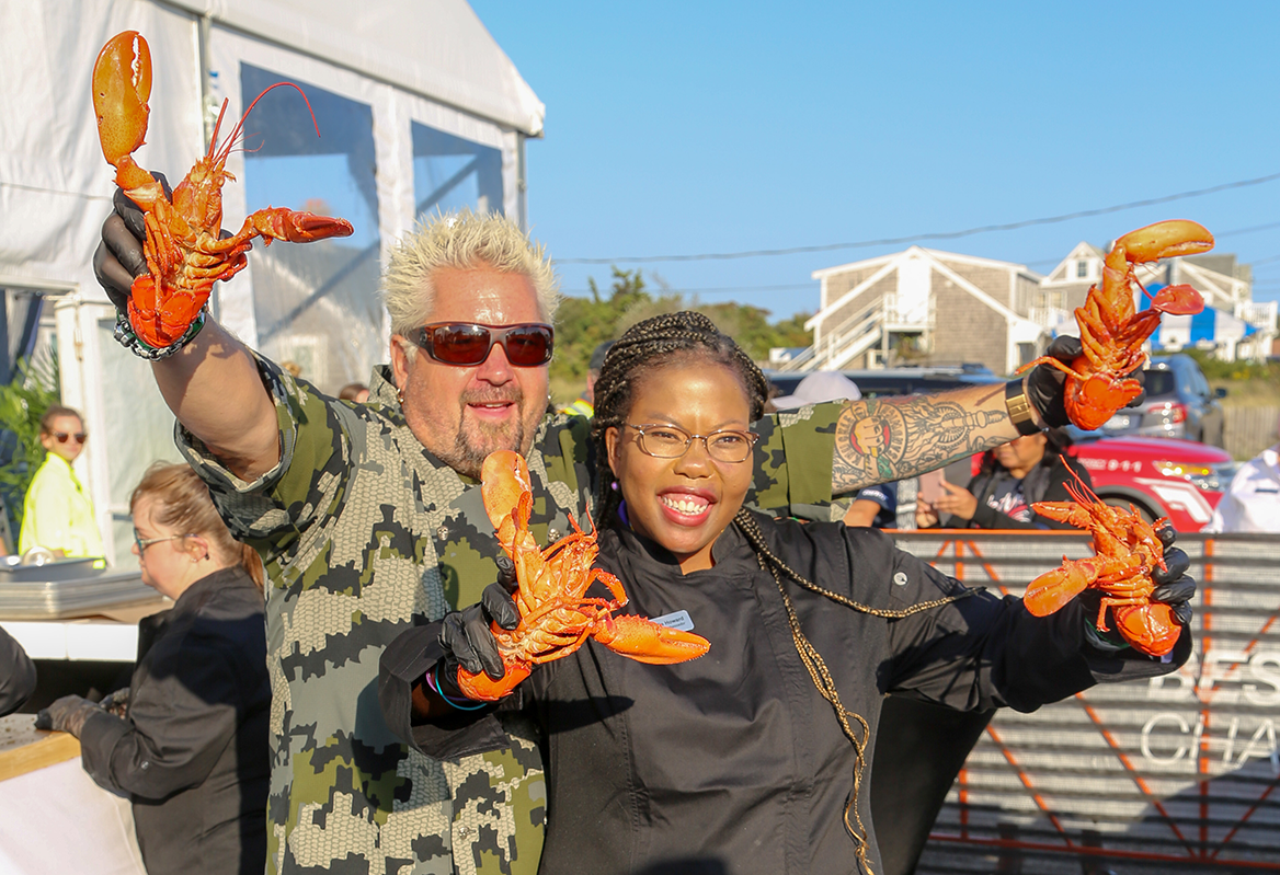 Guy Fieri with Best Buddies holding lobsters