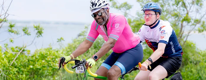 domestique on tandem bike with a buddy